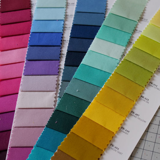 An AGF PURE Solids color card cut into strips ready to be made into magnetic swatches